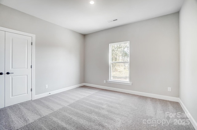 522 Fern Hill Rd Unit 17, Mooresville, NC 28117 - empty room with visible vents, baseboards, recessed lighting, and light colored carpet