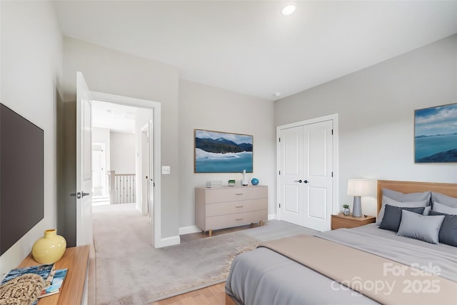 522 Fern Hill Rd Unit 17, Mooresville, NC 28117 - bedroom with a closet, light wood finished floors, and baseboards