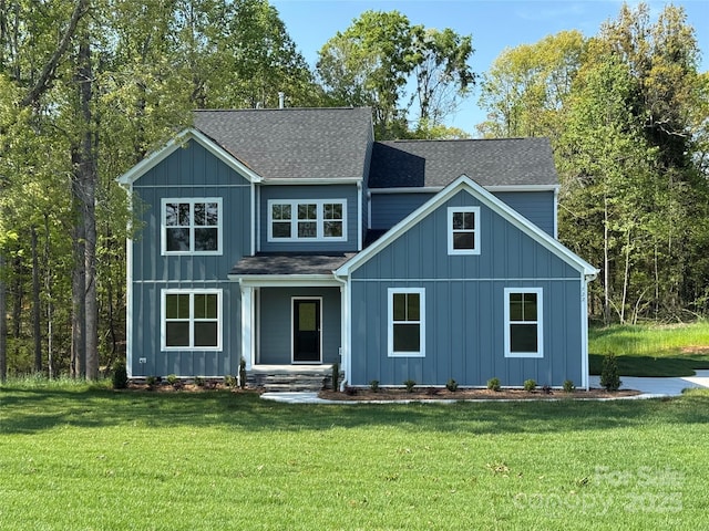 522 Fern Hill Rd Unit 17, Mooresville, NC 28117 - view of front of home featuring a front yard, roof with shingles, and board and batten siding
