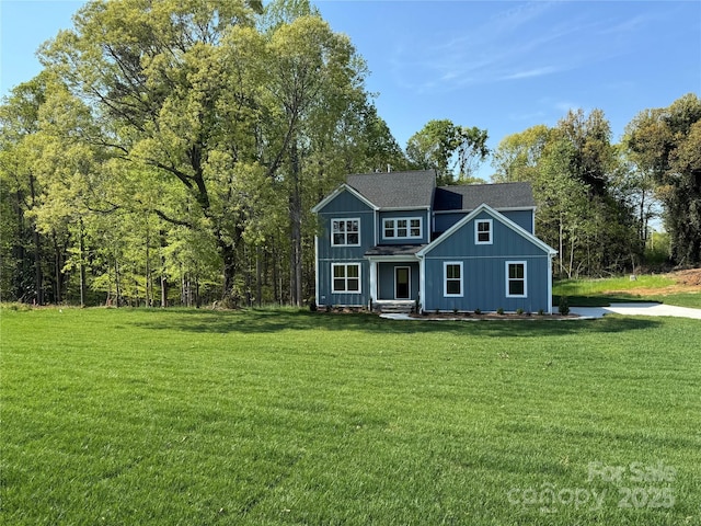 522 Fern Hill Rd Unit 17, Mooresville, NC 28117 - view of front facade featuring roof with shingles, board and batten siding, and a front lawn