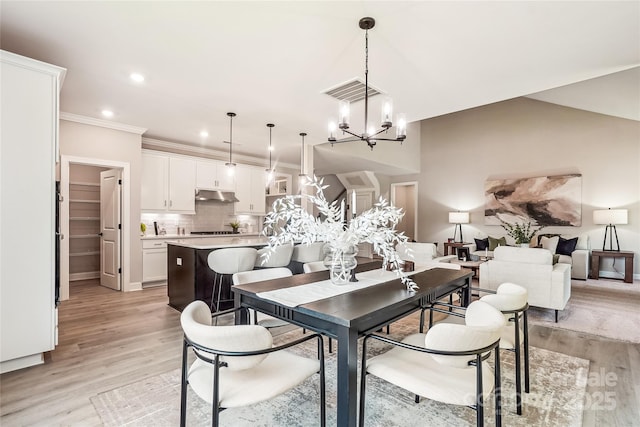522 Fern Hill Rd Unit 17, Mooresville, NC 28117 - dining room with light wood-style floors, a chandelier, recessed lighting, and ornamental molding