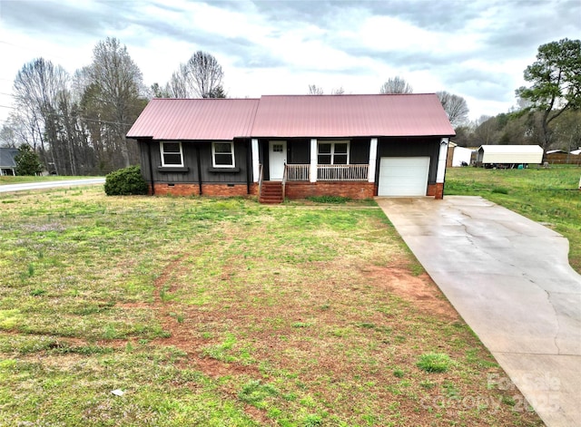 view of front of home with a porch, metal roof, concrete driveway, an attached garage, and crawl space