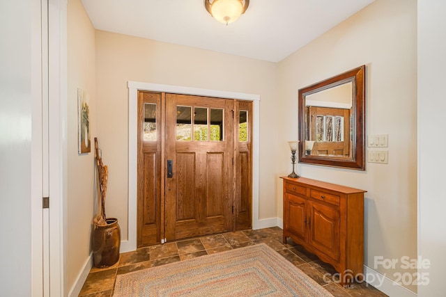 315 Jocassee Trl, Sapphire, NC 28774 - foyer entrance featuring stone tile floors and baseboards