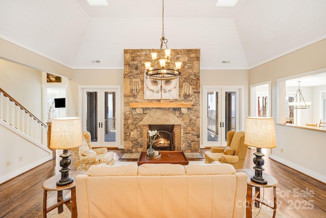 315 Jocassee Trl, Sapphire, NC 28774 - living area featuring stairway, a notable chandelier, wood finished floors, and high vaulted ceiling