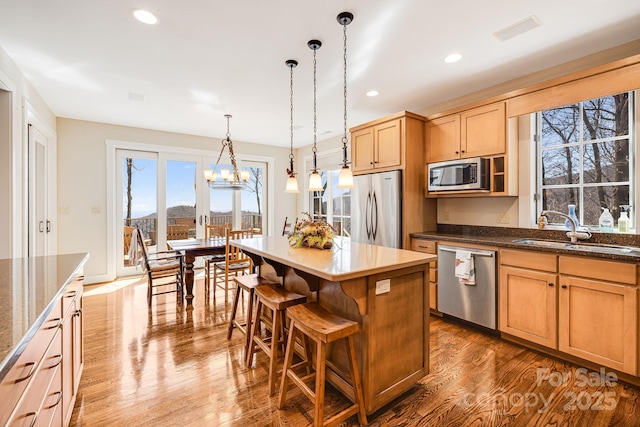 315 Jocassee Trl, Sapphire, NC 28774 - kitchen with a sink, dark wood finished floors, a center island, recessed lighting, and appliances with stainless steel finishes