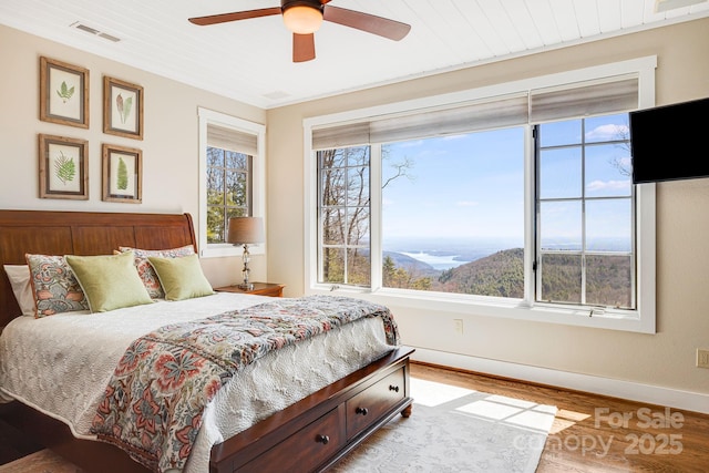 315 Jocassee Trl, Sapphire, NC 28774 - bedroom with ceiling fan, visible vents, baseboards, and wood finished floors