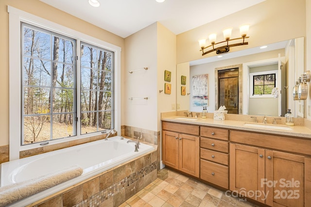 315 Jocassee Trl, Sapphire, NC 28774 - bathroom featuring plenty of natural light, a bath, a stall shower, and a sink