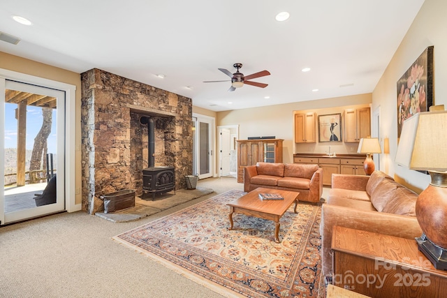 315 Jocassee Trl, Sapphire, NC 28774 - living area featuring ceiling fan, a wood stove, recessed lighting, and light carpet