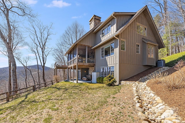 315 Jocassee Trl, Sapphire, NC 28774 - rear view of house with a patio, cooling unit, a yard, a sunroom, and a chimney