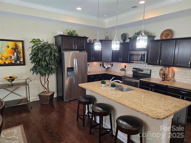 1112 Avalon Pl, Stallings, NC 28104 - kitchen featuring stainless steel appliances, a sink, a kitchen breakfast bar, dark wood-style floors, and light stone counters
