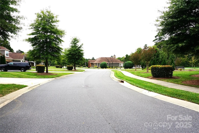 1112 Avalon Pl, Stallings, NC 28104 - view of asphalt road with curbs and sidewalks