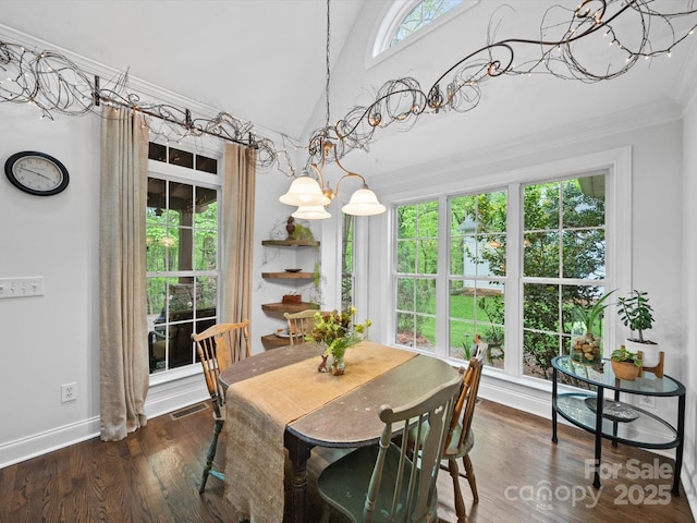 dining room with dark wood-type flooring, visible vents, crown molding, and baseboards