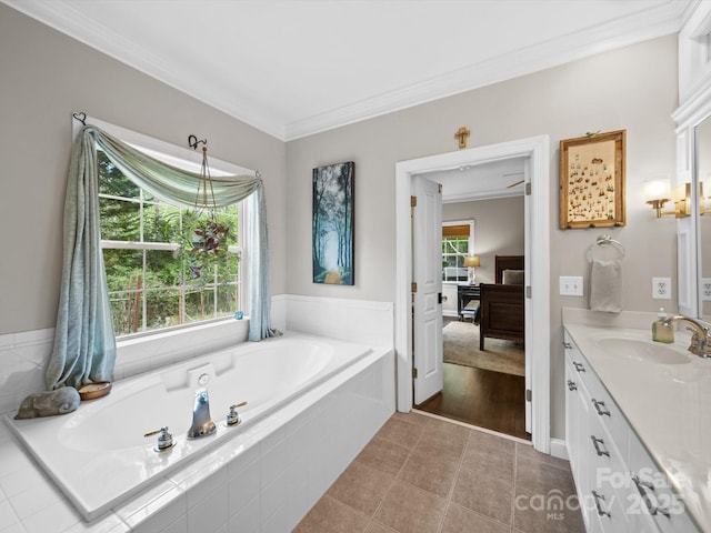bathroom with tile patterned floors, a garden tub, vanity, and crown molding