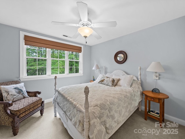 bedroom featuring baseboards, carpet flooring, and visible vents