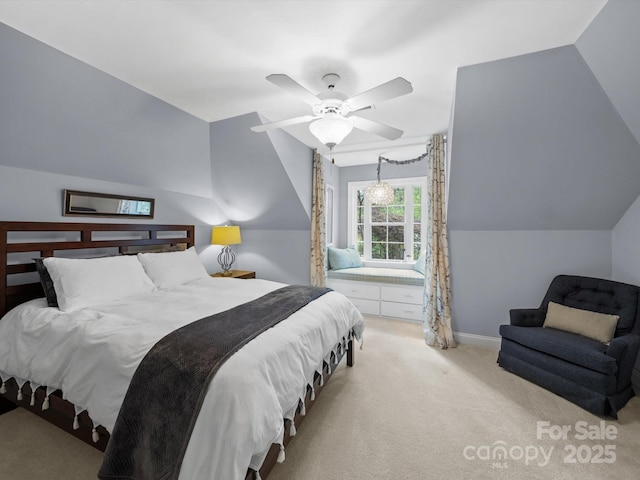 bedroom with a ceiling fan, carpet floors, lofted ceiling, and baseboards