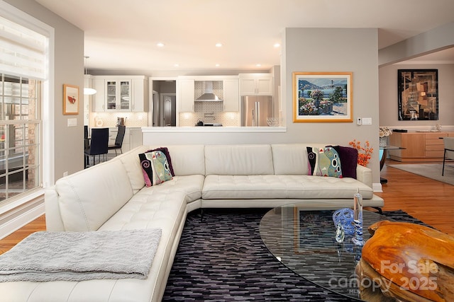 living room featuring recessed lighting and light wood finished floors