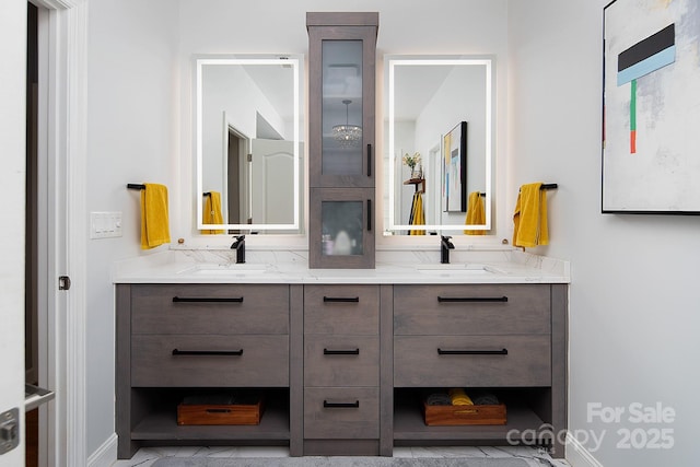 bathroom featuring double vanity and a sink