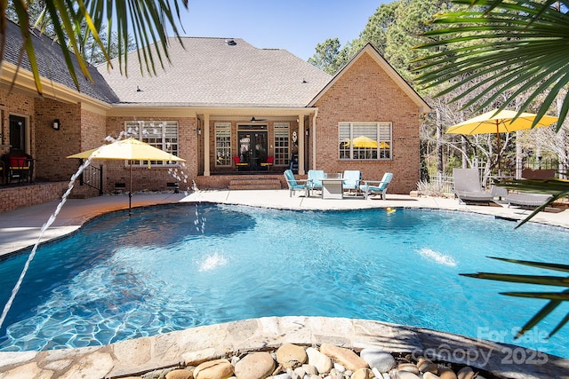pool featuring fence and a patio