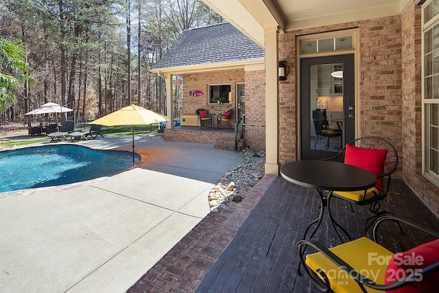 outdoor pool with a patio area