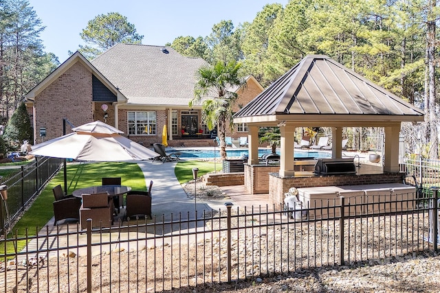 surrounding community with a patio, a fenced backyard, a gazebo, and a swimming pool
