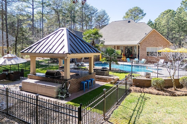view of pool with fence, a gazebo, a fenced in pool, and a patio area