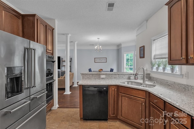 1017 Chalk Hill Ln, Charlotte, NC 28214 - kitchen with high quality fridge, dishwasher, a sink, ornate columns, and crown molding