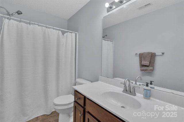 1017 Chalk Hill Ln, Charlotte, NC 28214 - bathroom with toilet, vanity, tile patterned floors, and a shower with curtain