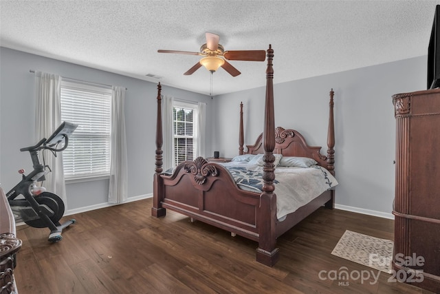 1017 Chalk Hill Ln, Charlotte, NC 28214 - bedroom with a textured ceiling, wood finished floors, baseboards, and a ceiling fan