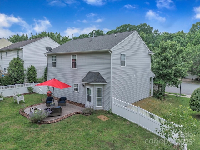 1017 Chalk Hill Ln, Charlotte, NC 28214 - back of property featuring a patio and roof with shingles