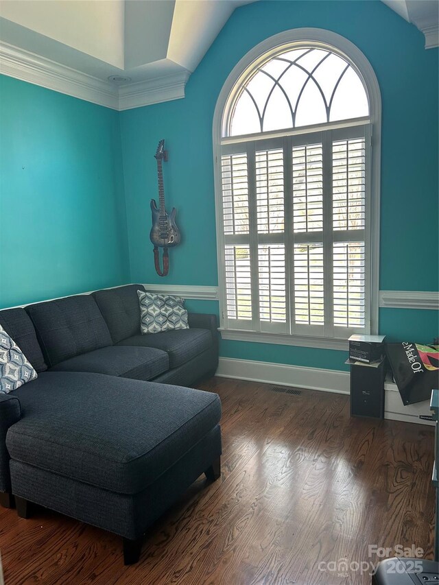 1308 Moonshadow Ln, Shelby, NC 28150 - living room featuring visible vents, crown molding, baseboards, dark wood finished floors, and lofted ceiling