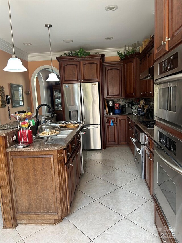 1308 Moonshadow Ln, Shelby, NC 28150 - kitchen with arched walkways, light tile patterned floors, crown molding, and a sink