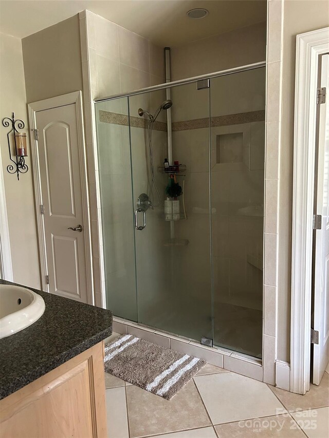 1308 Moonshadow Ln, Shelby, NC 28150 - bathroom with vanity, a shower stall, and tile patterned floors