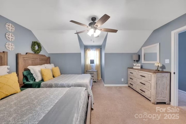 bedroom featuring baseboards, lofted ceiling, ceiling fan, and light colored carpet
