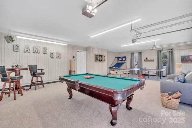 playroom with pool table, carpet flooring, and a garage