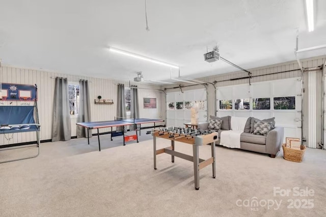 game room with carpet flooring and a garage