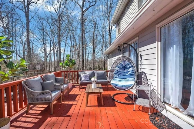 wooden deck with an outdoor living space
