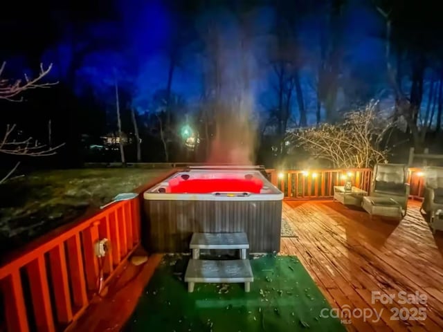 exterior space with a hot tub and a wooden deck