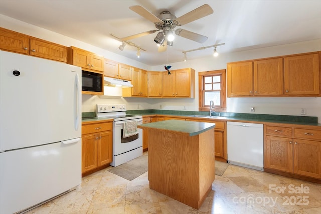 1506 Lynn Rd, Columbus, NC 28722 - kitchen with white appliances, rail lighting, under cabinet range hood, and a kitchen island