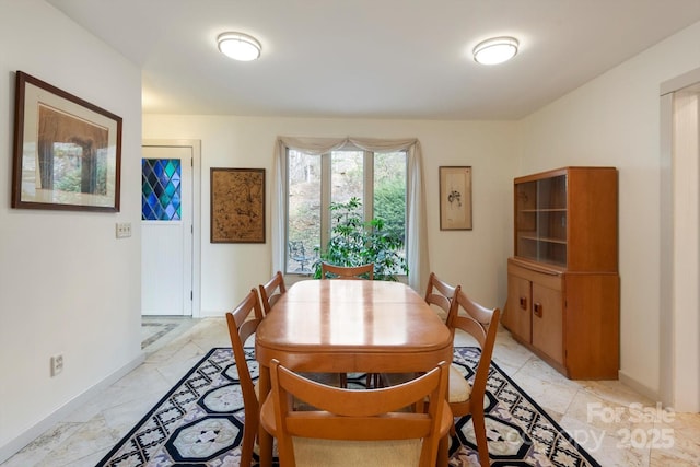 1506 Lynn Rd, Columbus, NC 28722 - dining space featuring baseboards and light marble finish flooring