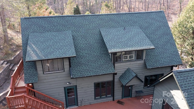 1506 Lynn Rd, Columbus, NC 28722 - rear view of house with a shingled roof, stairs, a wooden deck, and a forest view