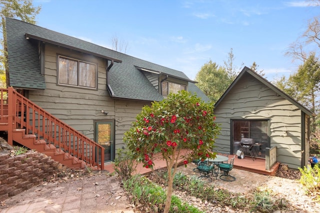 1506 Lynn Rd, Columbus, NC 28722 - rear view of property featuring a deck, a shingled roof, and stairway