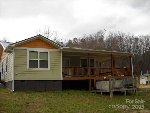 992 Hornet Dr, Whittier, NC 28789 - back of house featuring crawl space and a yard