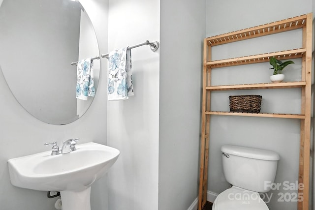5807 Mctaggart Ln, Charlotte, NC 28269 - bathroom featuring toilet and a sink