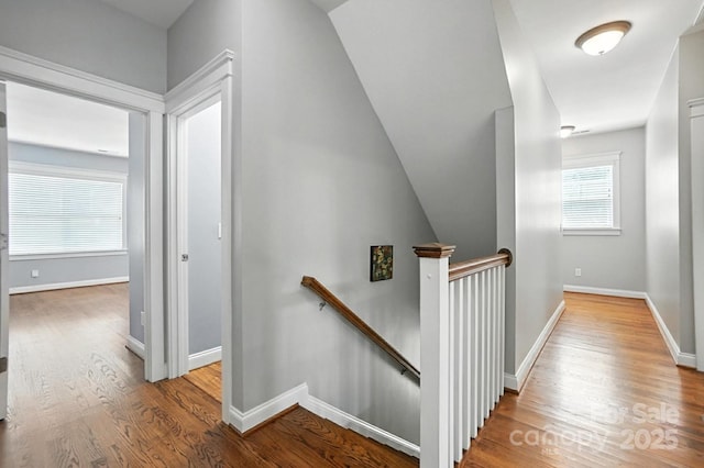 5807 Mctaggart Ln, Charlotte, NC 28269 - corridor featuring an upstairs landing and wood finished floors