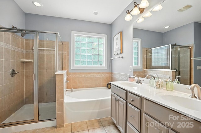 5807 Mctaggart Ln, Charlotte, NC 28269 - full bath featuring a bath, tile patterned flooring, a stall shower, and double vanity