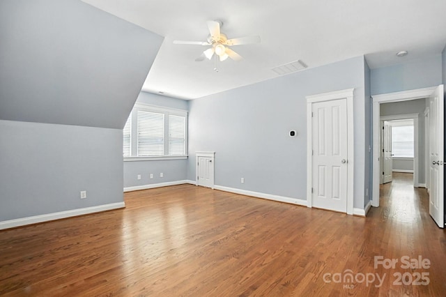 5807 Mctaggart Ln, Charlotte, NC 28269 - bonus room with a ceiling fan and wood finished floors