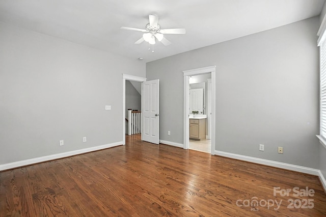 5807 Mctaggart Ln, Charlotte, NC 28269 - unfurnished bedroom featuring wood finished floors, ensuite bath, and a ceiling fan