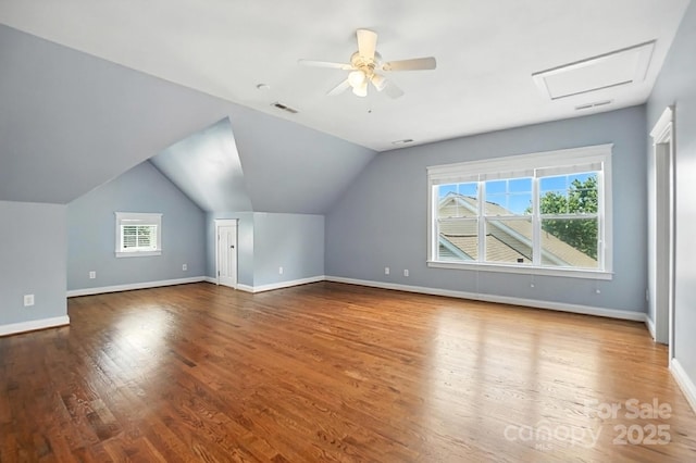5807 Mctaggart Ln, Charlotte, NC 28269 - additional living space with wood finished floors, ceiling fan, lofted ceiling, and attic access