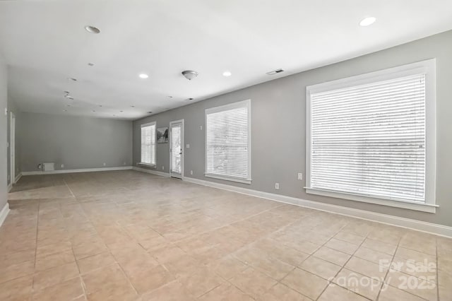5807 Mctaggart Ln, Charlotte, NC 28269 - unfurnished room with light tile patterned floors and recessed lighting
