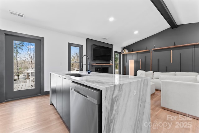 5501 Joyce Dr, Charlotte, NC 28215 - kitchen with dishwasher, a sink, plenty of natural light, light stone counters, and recessed lighting